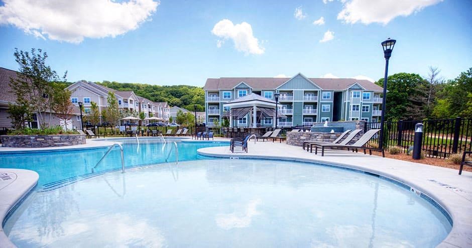 a large swimming pool with a building in the background  at Lullwater at Big Ridge, Hixson, TN, 37343