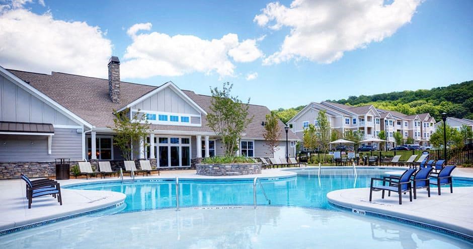a large swimming pool with chairs in front of a building  at Lullwater at Big Ridge, Tennessee, 37343