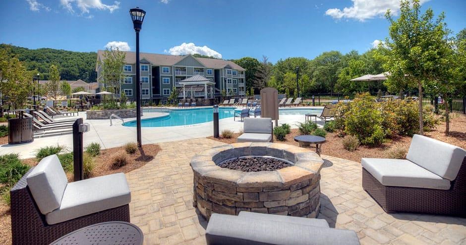an outdoor patio with a fire pit and a swimming pool an outdoor patio with a fire pit and a swimming pool at Lullwater at Big Ridge, Tennessee, 37343