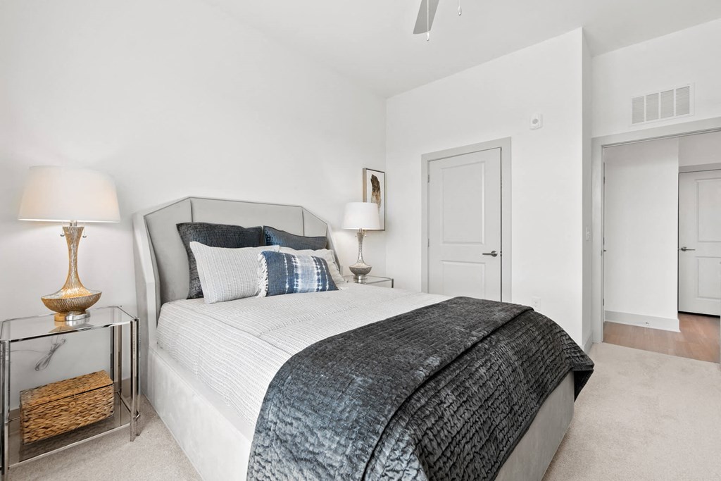 a bedroom with a bed and a nightstand at Tapestry West, Richmond