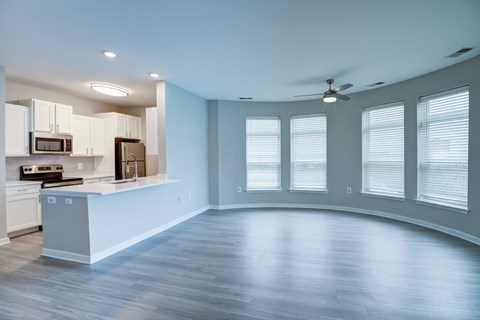 A spacious kitchen with a countertop and cabinets.