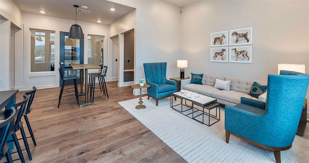 a living room with a couch chairs and tables at Livingston Flats Apartments, Chesterfield, ,23832