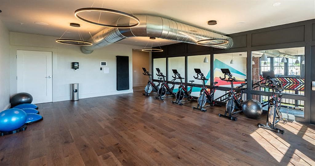 a room with exercise bikes in it at Livingston Flats Apartments, Chesterfield, VA