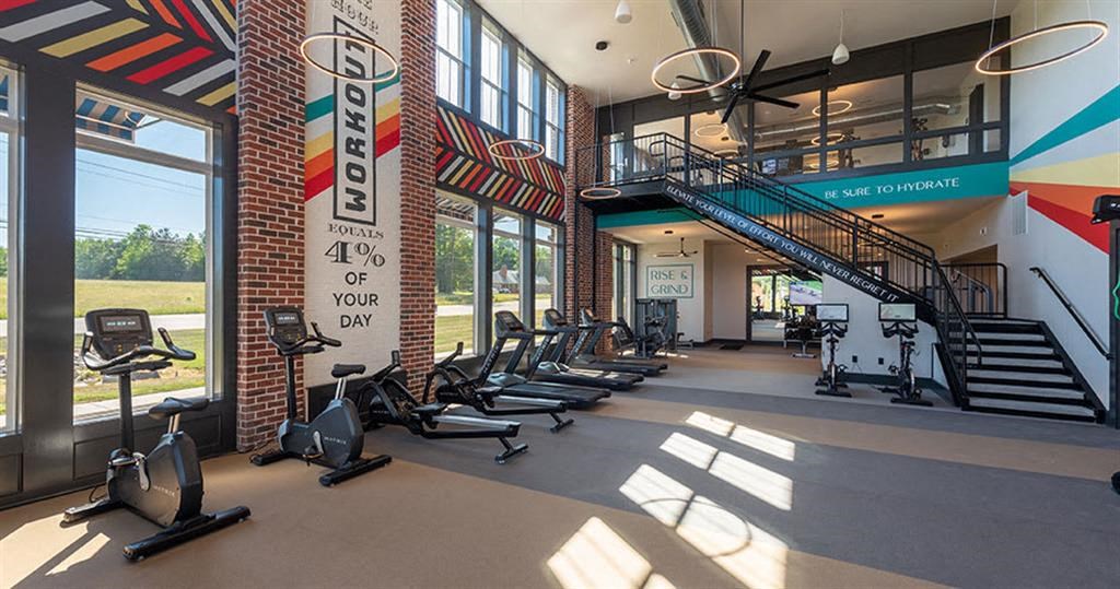 a gym with treadmills and other exercise equipment at  Livingston Flats Apartments, Virginia