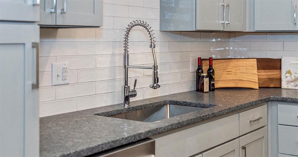 a kitchen with a sink and a faucet at Livingston Flats Apartments, Chesterfield