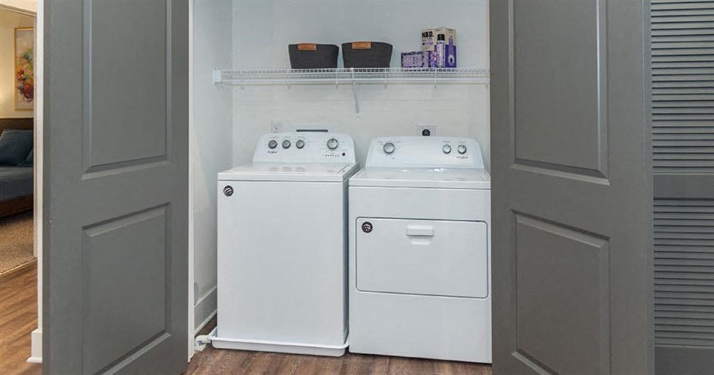 a white washer and dryer in a room at Livingston Flats Apartments, Chesterfield, Virginia