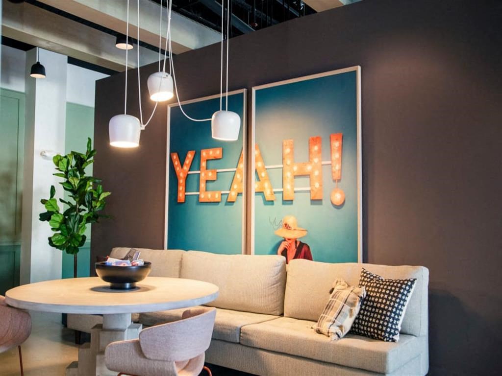 a living room with a couch table and chairs at Flats at West Broad Village, Glen Allen, VA