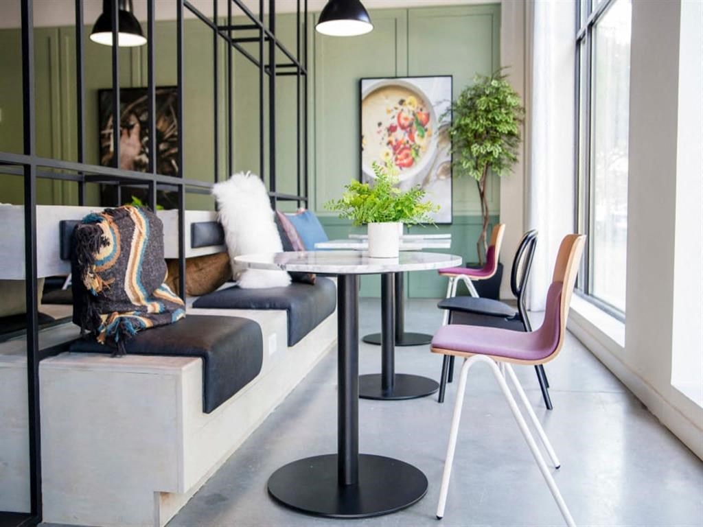 a living room with a couch and a table at Flats at West Broad Village, Glen Allen, 23060