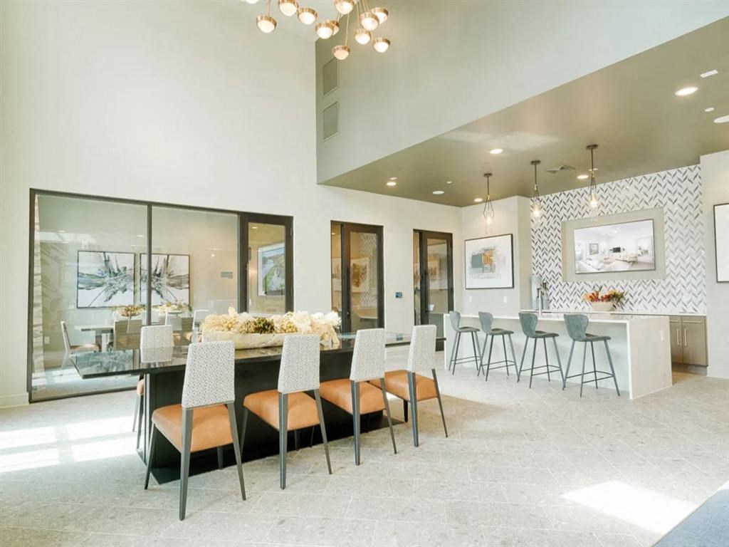 a dining room with a long table and chairs at Artistry at Winterfield Apartments, Virginia,23112