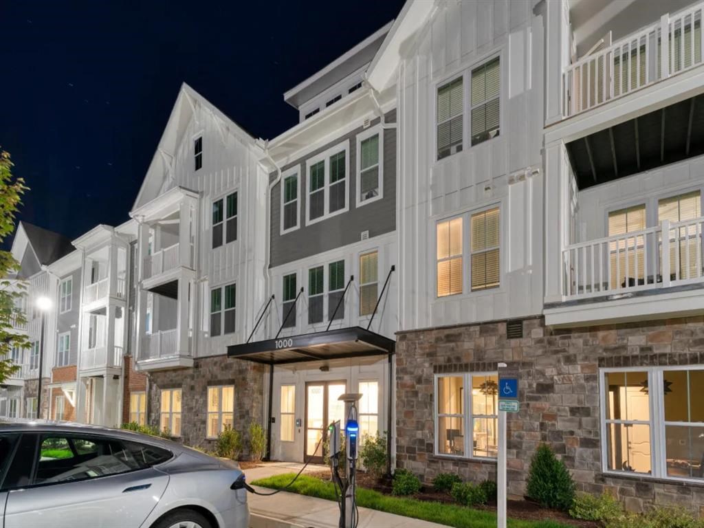 a car parked in front of a building at Artistry at Winterfield Apartments, Midlothian