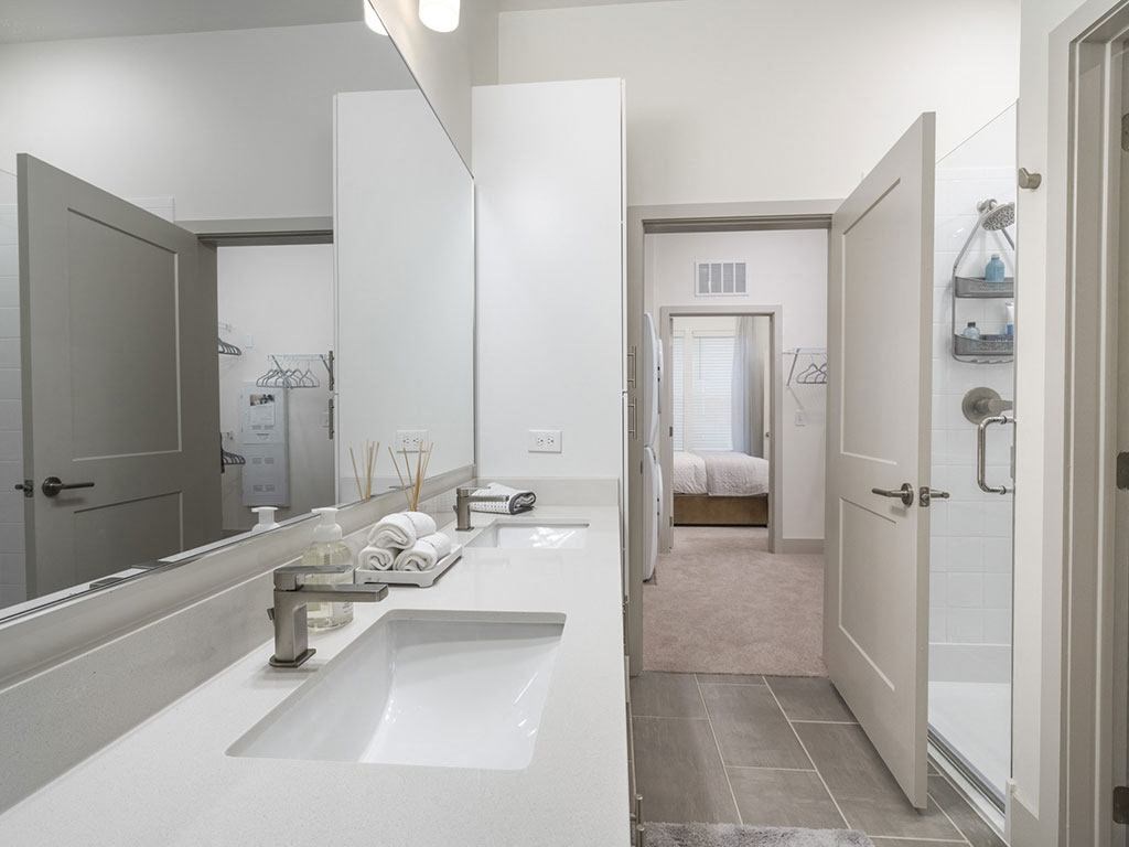 a bathroom with a sink and a shower at Artistry at Winterfield Apartments, Virginia