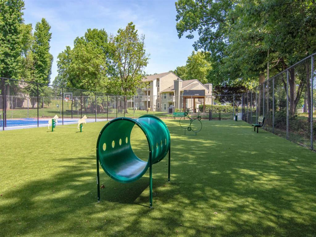 our apartments showcase a dog park with plenty of room to run and play our apartments showcase a dog park with plenty of room to run and play at Hunters Chase Apartments, Virginia