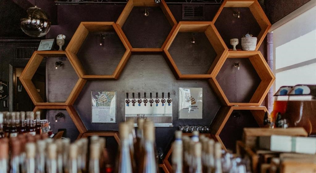 a wall of honeycomb frames in a restaurant
