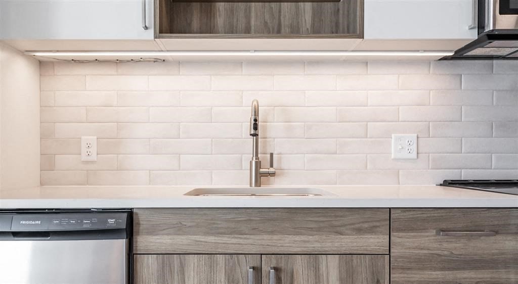 a kitchen with a sink and a dishwasher