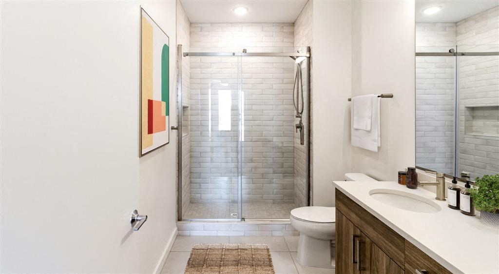 a bathroom with a toilet sink and shower