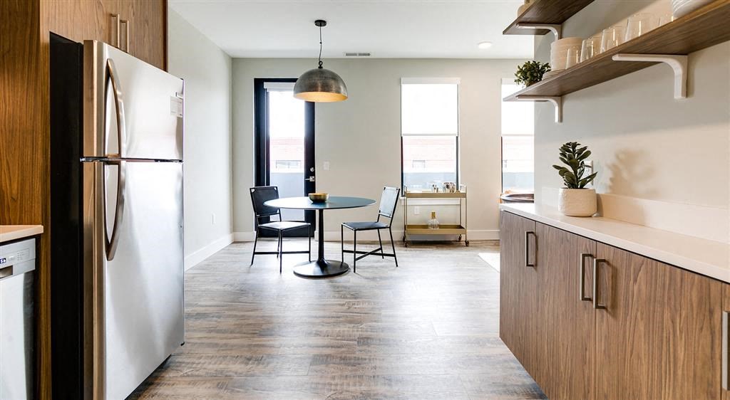 a kitchen and dining area in a 555 waverly unit