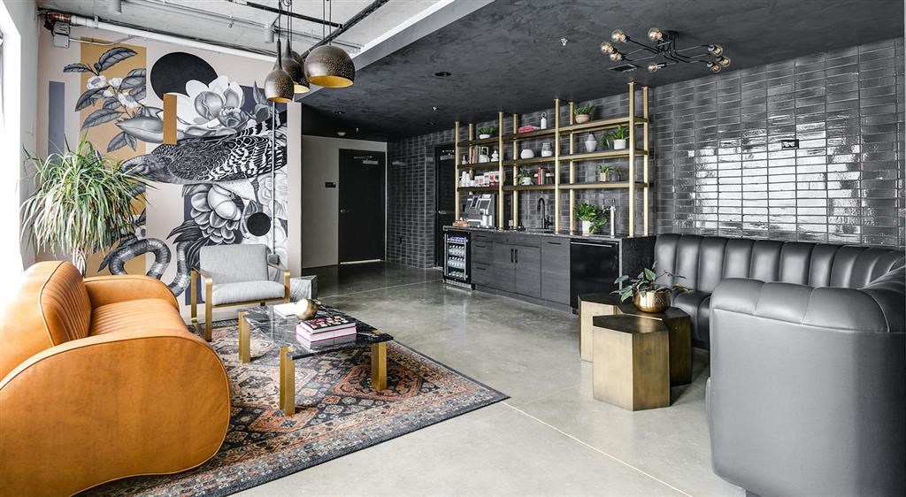 a living room with a leather couch and a coffee table