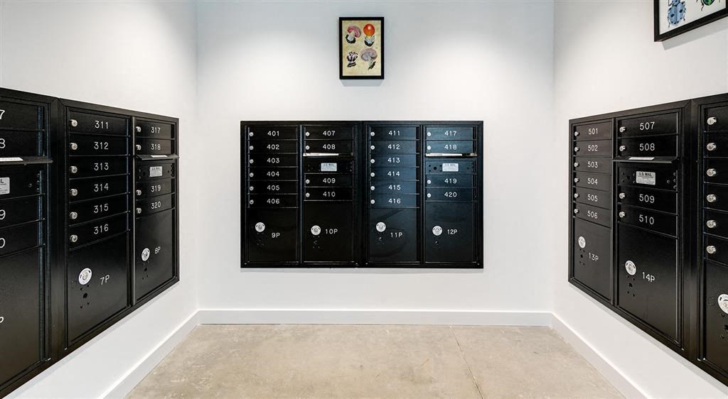 a room with lockers and a painting on the wall