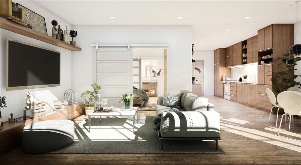 a living room filled with furniture and a flat screen tv