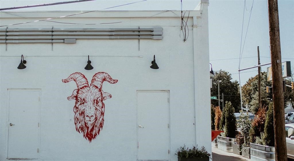 a mural of aries on the side of a building