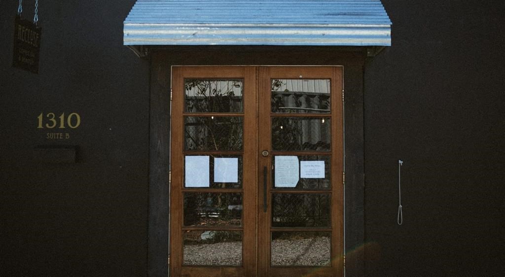 a door with some white papers on it