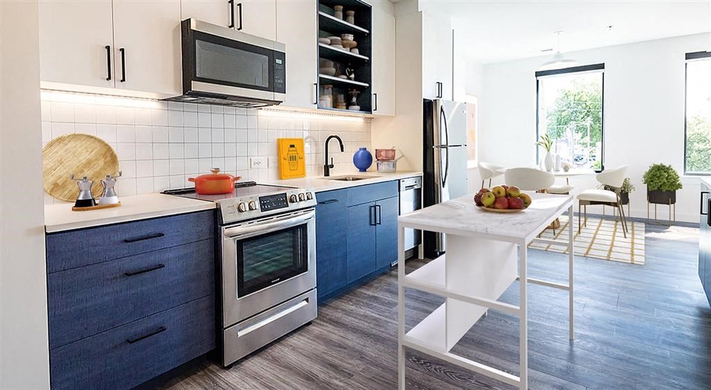 a kitchen with a stove top oven next to a table