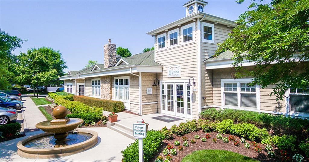a house with a fountain in front of it  at Saltmeadow Bay, Virginia Beach, VA