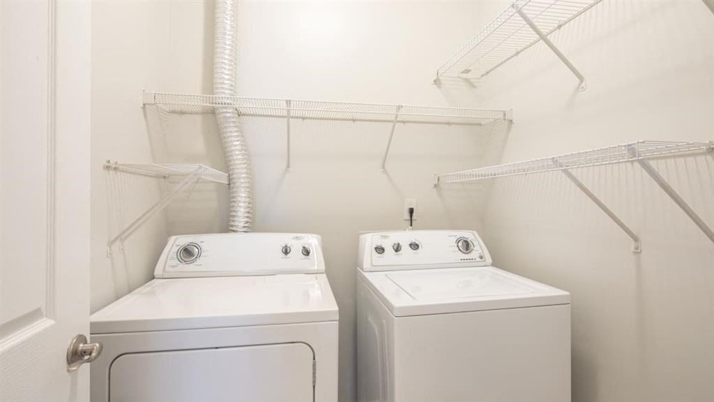 a washer and dryer in a white room  at Saltmeadow Bay, Virginia Beach, 23451