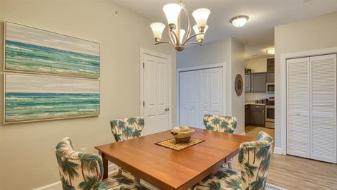 a dining room with a table and chairs a dining room with a table and chairs