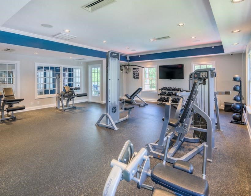 a gym with a lot of exercise equipment in it at Sterling Manor, Williamsburg Virginia