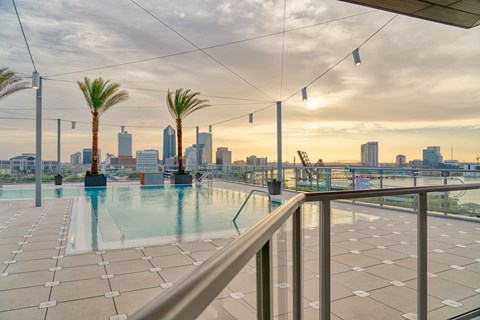 the swimming pool on the roof of a building with the city skyline in the background at Vista Brooklynn Apartments, Florida