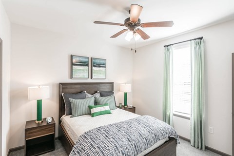 a bedroom with a bed and a ceiling fan at Village at Westland Cove Apartments, Knoxville, 37922