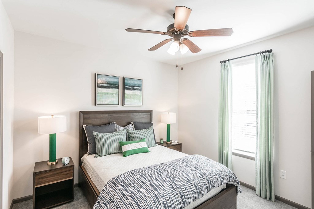 a bedroom with a bed and a ceiling fan a bedroom with a bed and a ceiling fan at Village at Westland Cove Apartments, Knoxville, 37922