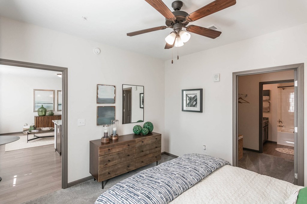 a bedroom with a bed and a ceiling fan at Village at Westland Cove Apartments, Tennessee, 37922
