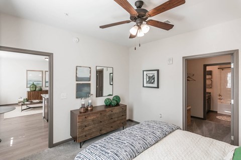 a bedroom with a bed and a ceiling fan at Village at Westland Cove Apartments, Tennessee, 37922
