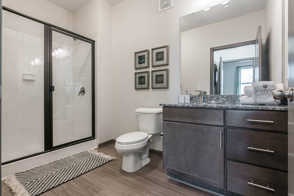 a bathroom with a shower and a toilet and a sink at Village at Westland Cove Apartments, Tennessee, 37922