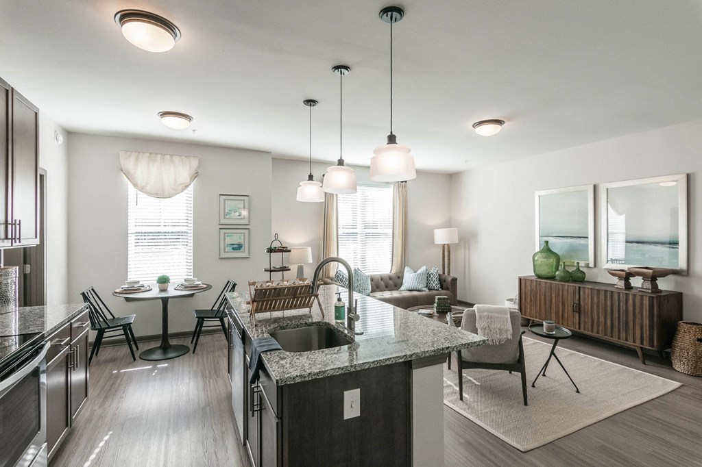 an open kitchen and living room with a table and chairs at Village at Westland Cove Apartments, Knoxville, TN, 37922