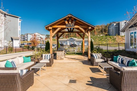the outdoor patio of a home with chairs and a gazebo at Village at Westland Cove Apartments, Knoxville, 37922