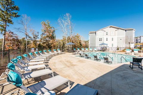 our apartments have a resort style pool with lounge chairs at Village at Westland Cove Apartments, Knoxville, TN, 37922