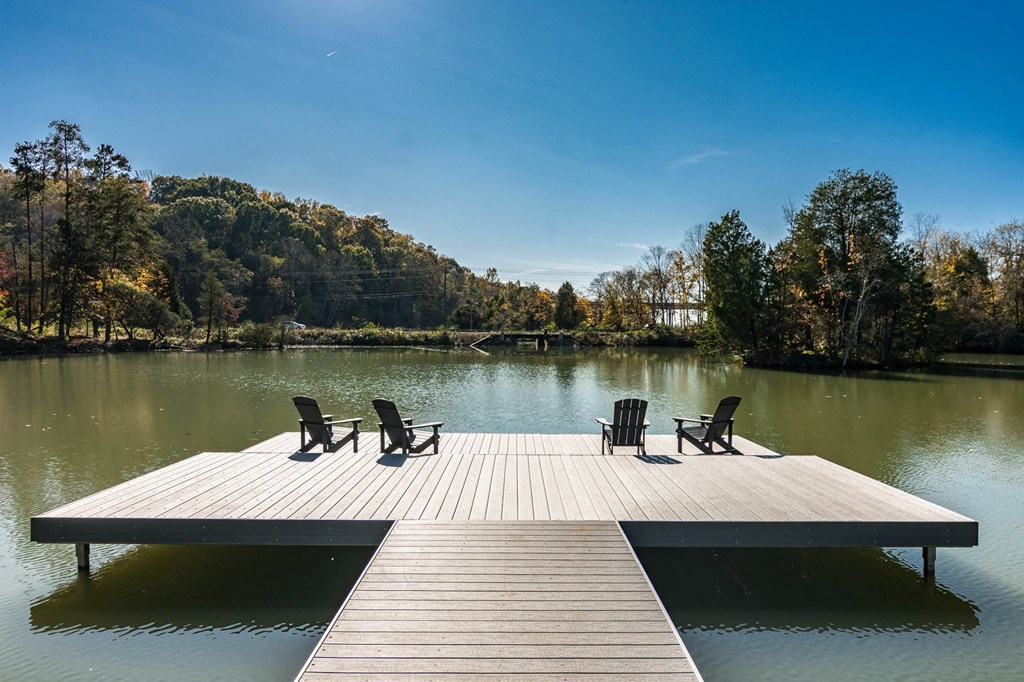 a dock at a lake with chairs on it at Village at Westland Cove Apartments, Knoxville