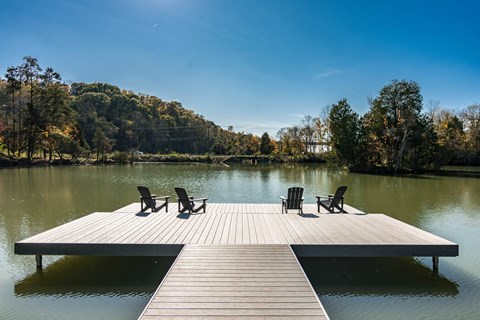 a dock at a lake with chairs on it at Village at Westland Cove Apartments, Knoxville