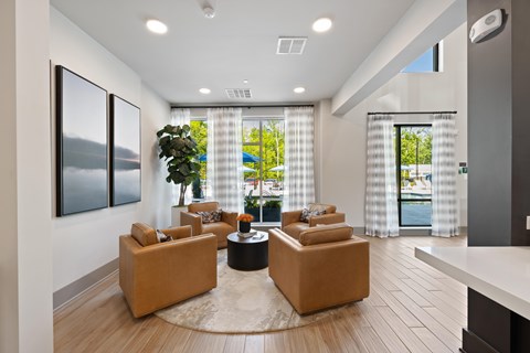 A living room with a large window and a view of the outside.