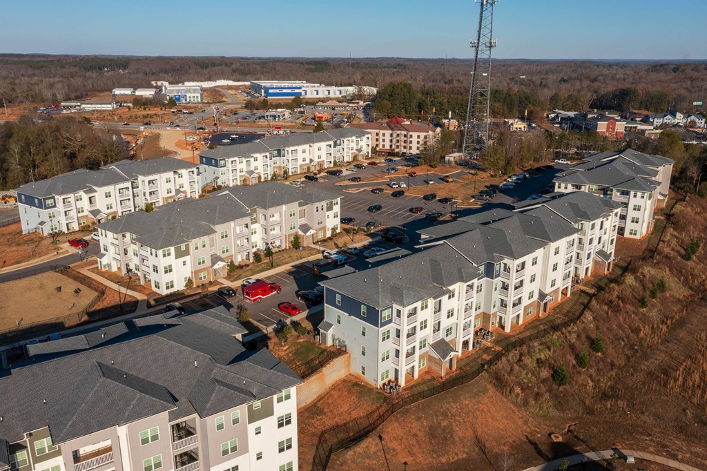 an aerial view of an apartment complex in a city at Capstone at Banks Crossing, Commerce, 30529