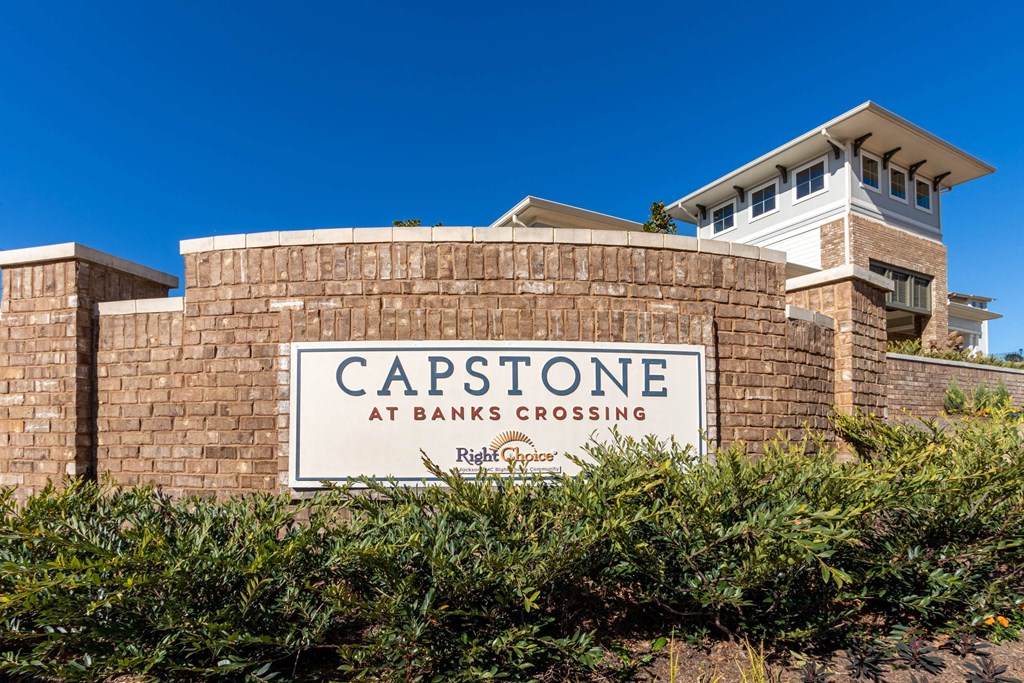 the capstone at banks crossing sign in front of a brick building at Capstone at Banks Crossing, Commerce, GA