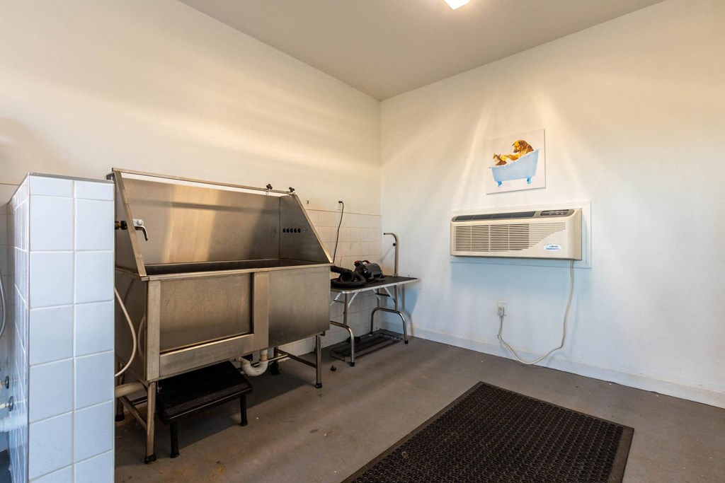 a room with a sink and a refrigerator at Capstone at Banks Crossing, Commerce