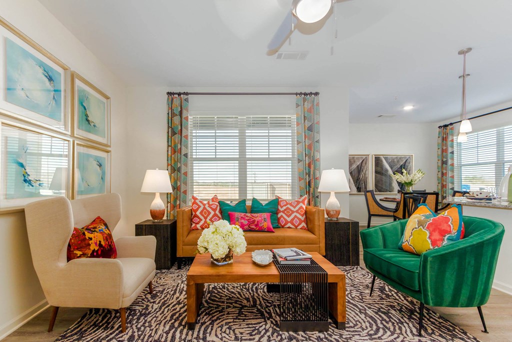 a living room filled with furniture and a window at Capstone at Banks Crossing, Commerce
