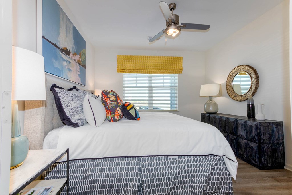 a bedroom with a large bed and a ceiling fan at Capstone at Banks Crossing, Commerce, GA