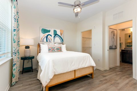 a bedroom with a bed and a ceiling fan at Capstone at Banks Crossing, Commerce, GA, 30529