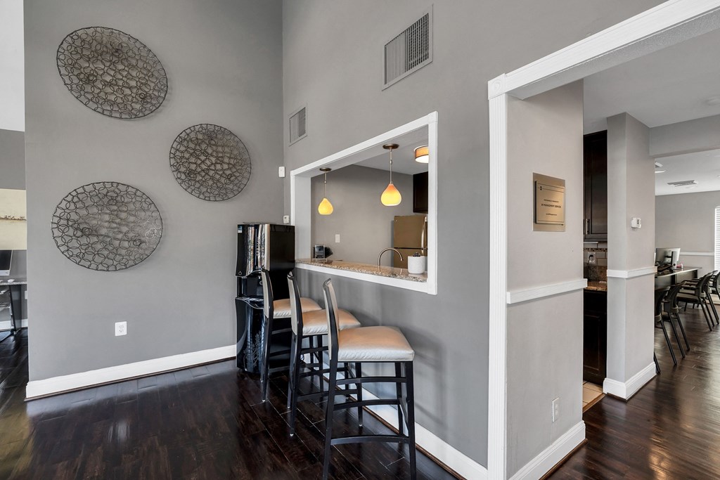 a bar area with stools and a refrigerator in a 555 waverly unit at Misty Ridge Apartments, Woodbridge, 22191