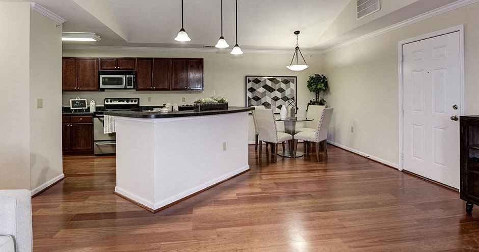 a kitchen and dining room with a table and chairs at SomerHill Farms Apartments, Gainesville, 20155